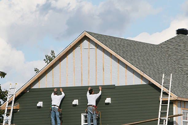 Professional Storm Damage Siding Repair technician working in Withams, VA